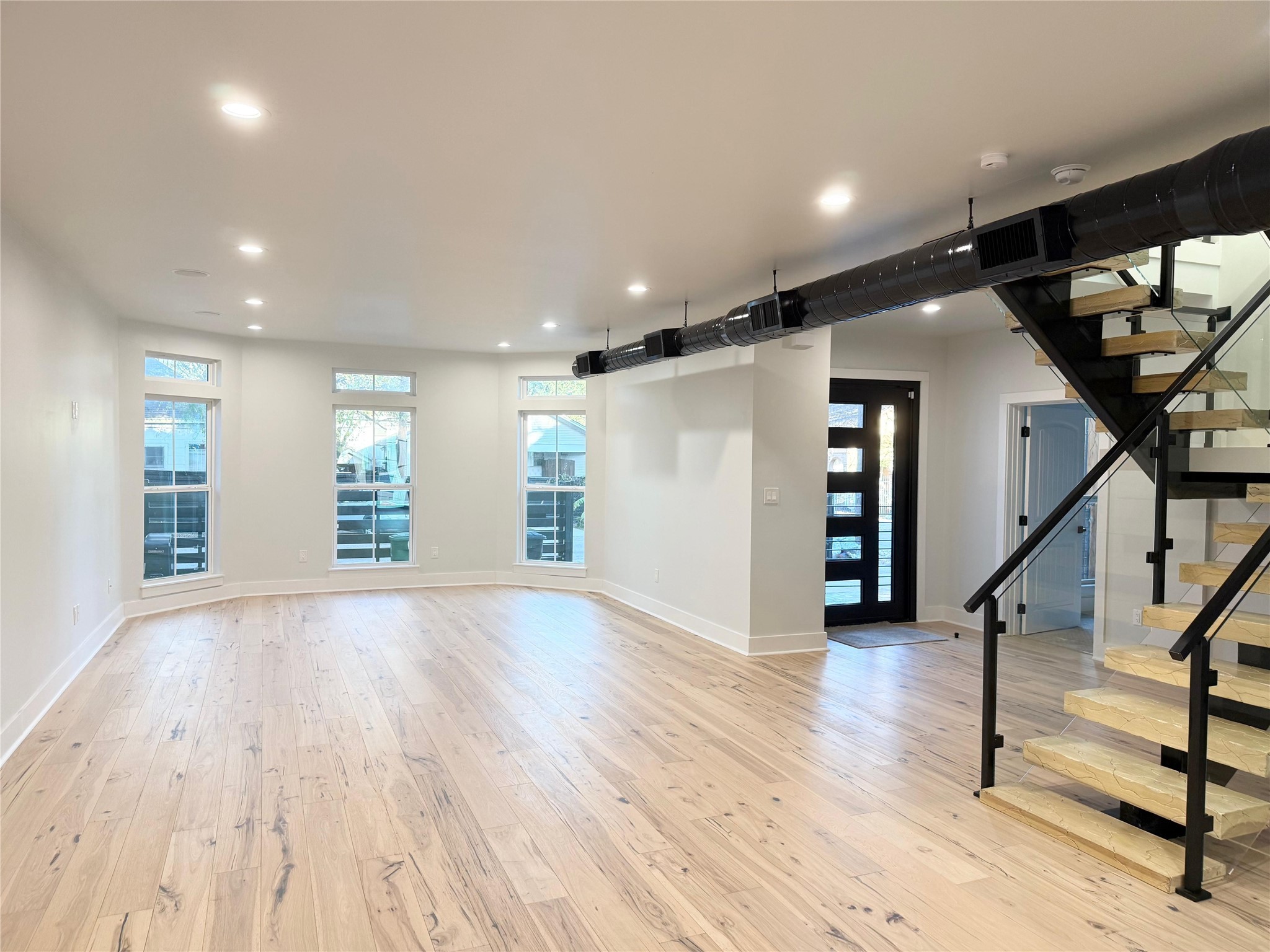 1617 Common Street Houston, TX 77009 - Photo 5 of 50 a view of empty room with wooden floor and fan