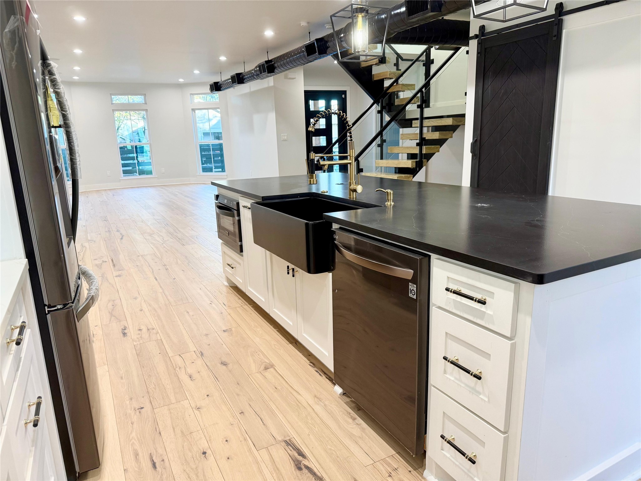 1617 Common Street Houston, TX 77009 - Photo 7 of 50 a kitchen with stainless steel appliances a stove and a refrigerator