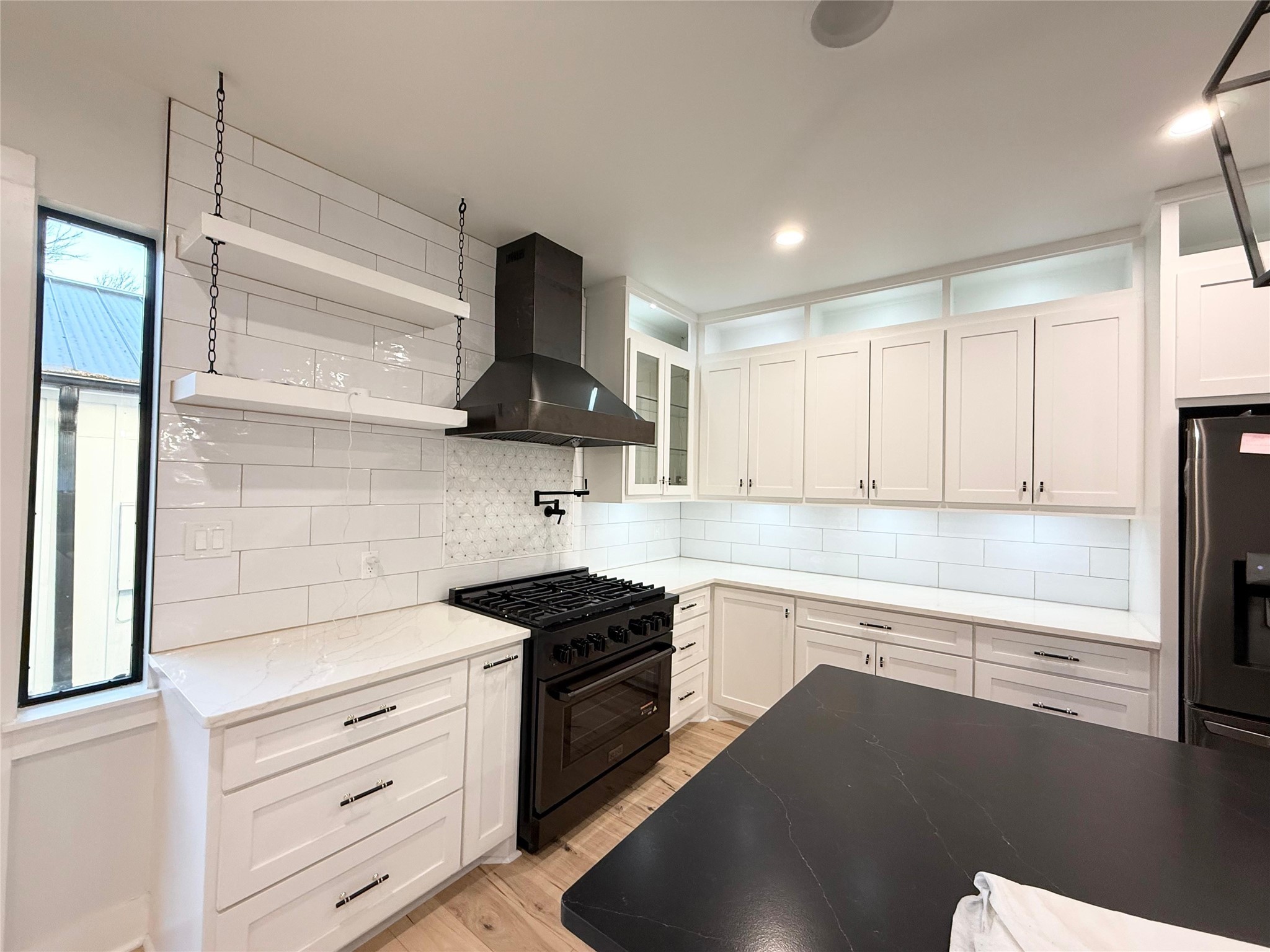 1617 Common Street Houston, TX 77009 - Photo 8 of 50 a kitchen with stainless steel appliances a sink stove and cabinets