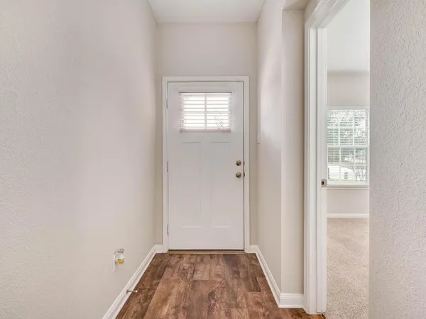 a view of a room that has a window in it