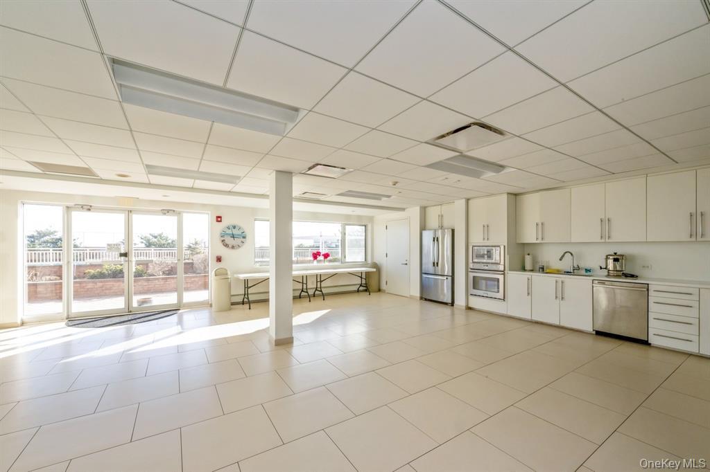 830 Shore Road, Unit 4Q Long Beach, NY 11561 - Photo 24 of 26 a large white room with a large window