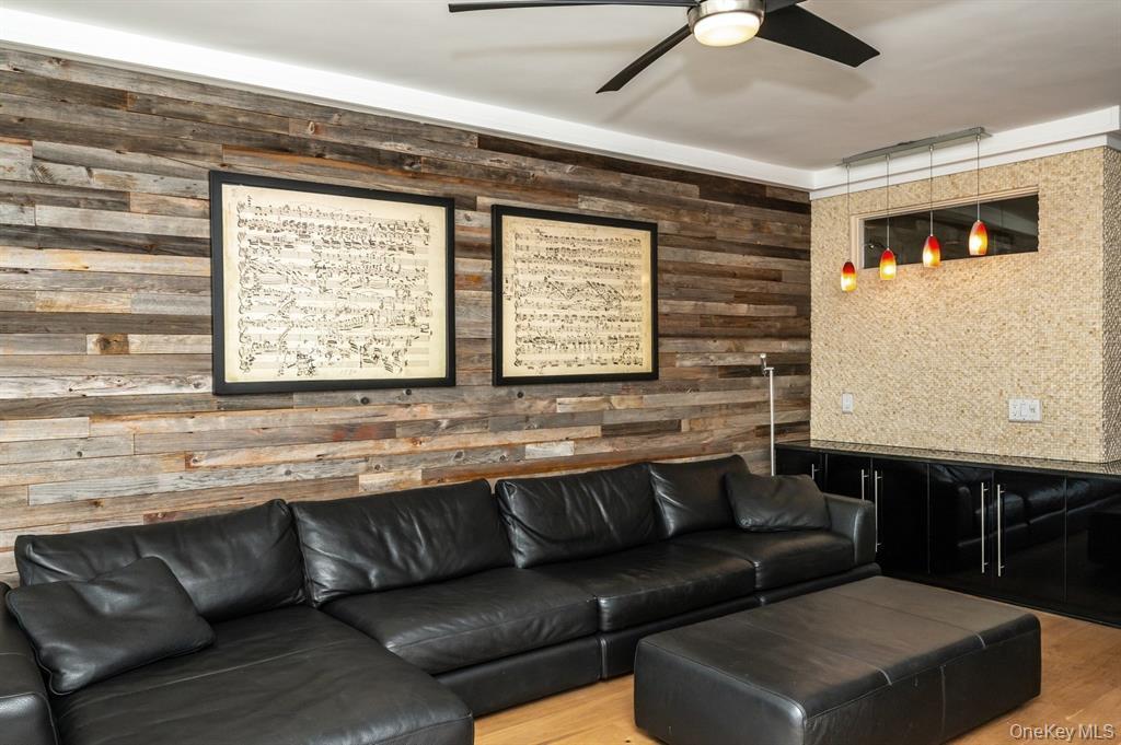 830 Shore Road, Unit 4Q Long Beach, NY 11561 - Photo 10 of 26 a living room with a couch and a table