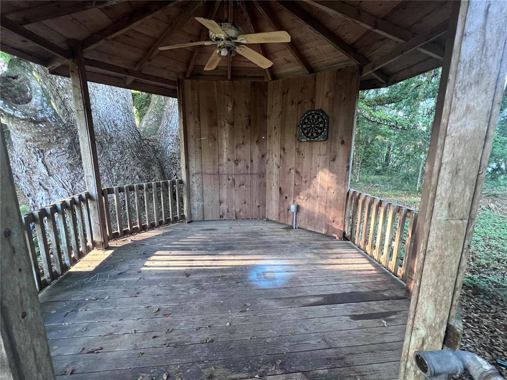 177 East 3rd Avenue Pierson, FL 32180 - Photo 8 of 16 a view of porch with wooden floor