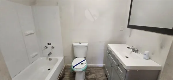 a bathroom with a sink toilet and bathtub