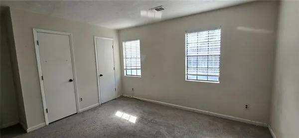 an empty room with windows