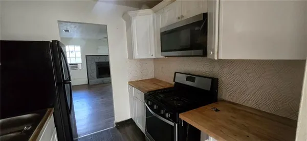 a kitchen with a stove and a microwave
