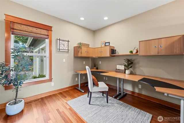 a workspace with furniture and window