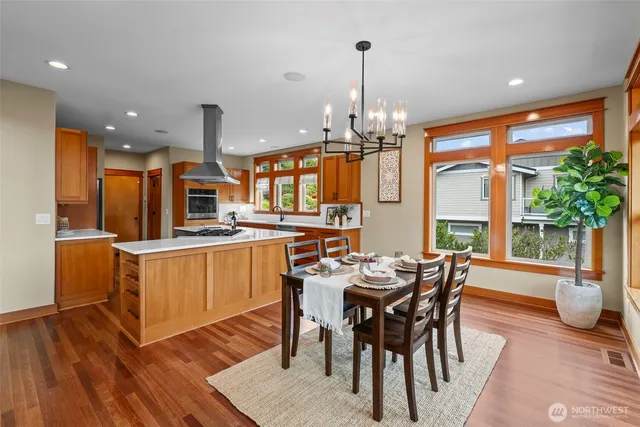 a large kitchen with a table and chairs