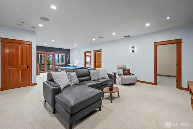 a living room with furniture and a walk in closet