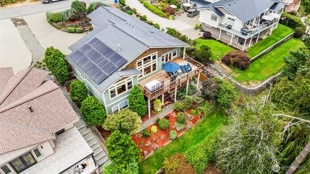 an aerial view of residential house with outdoor space and street view