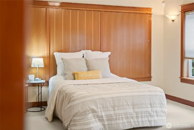 a large white bed in a white room