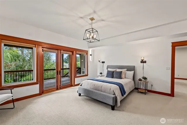 a spacious bedroom with a bed and a large window