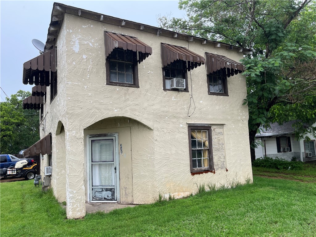 a front view of a house with garden