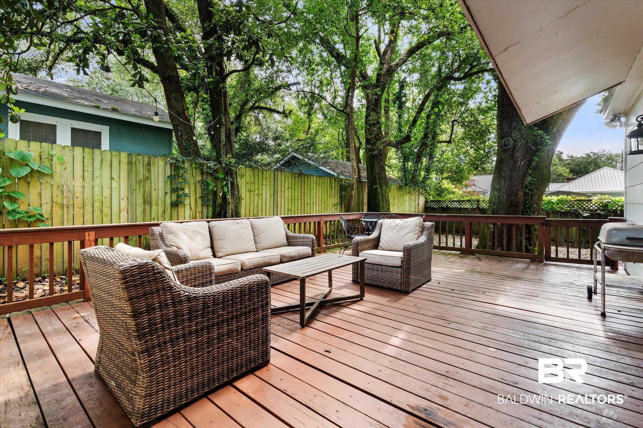 165 Crenshaw Street Mobile, AL 36606 - Photo 18 of 21 Deck featuring an outdoor hangout area and a fenced backyard