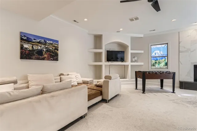 a living room with furniture and a painting