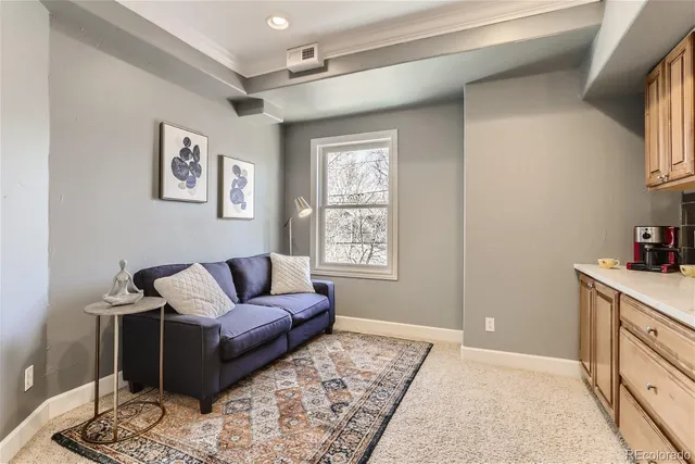 a living room with furniture and a window