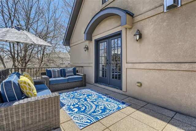 a living room with furniture and a rug
