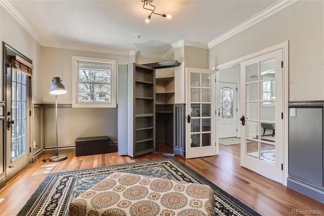 a bedroom with a bed and cabinets