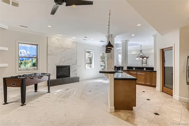 a large kitchen with a table and chairs in it