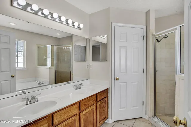 a living room with furniture a dining table and a chandelier