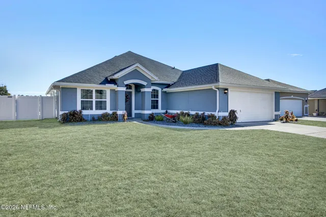 a front view of house with yard and seating area