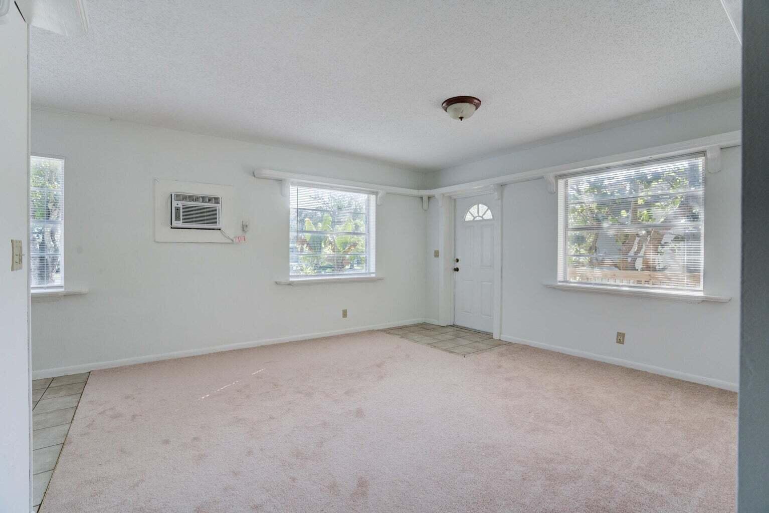 700 North Hepburn Avenue Jupiter, FL 33458 - Photo 6 of 16 an empty room with windows