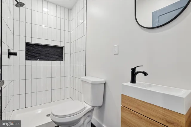 a bathroom with a toilet and a sink