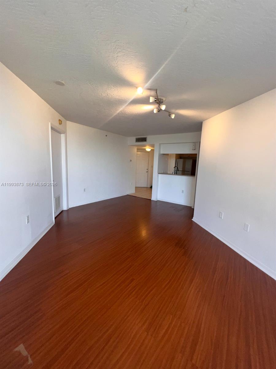 102 Southwest 6th Avenue, Unit 508 Miami, FL 33130 - Photo 11 of 27 a view of empty room with wooden floor