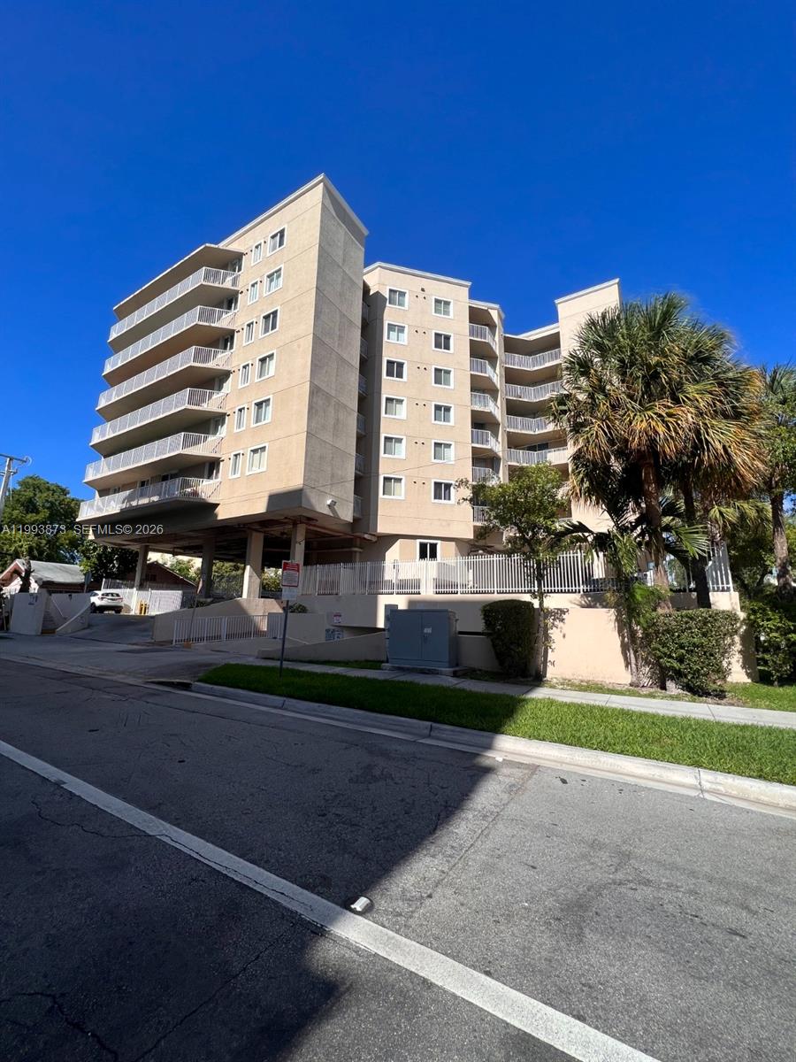 102 Southwest 6th Avenue, Unit 508 Miami, FL 33130 - Photo 2 of 27 a front view of a building with streets and trees