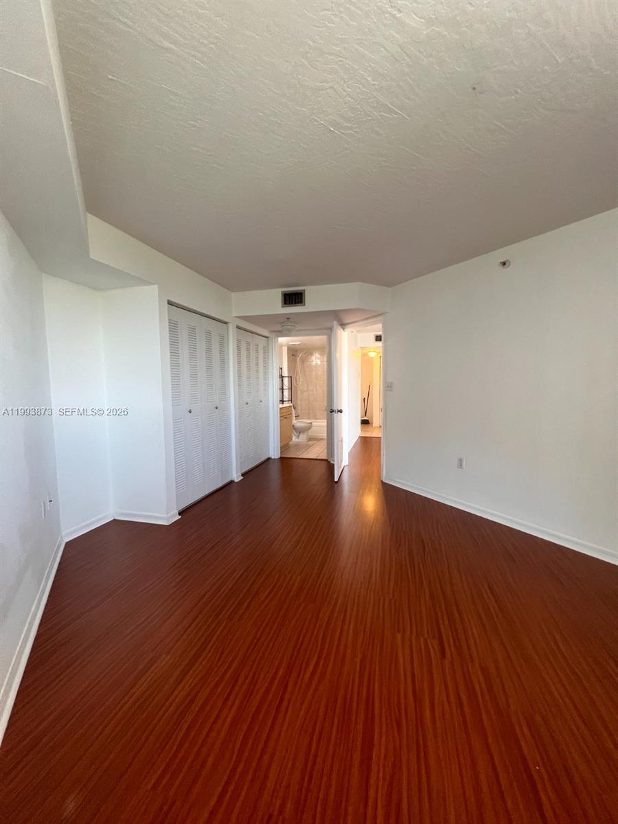 102 Southwest 6th Avenue, Unit 508 Miami, FL 33130 - Photo 25 of 27 a view of empty room with wooden floor