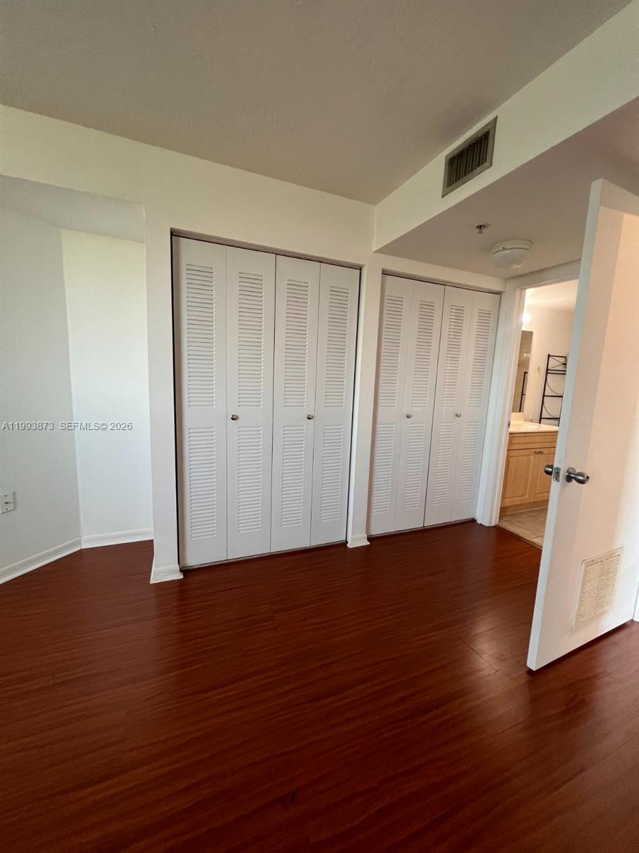 102 Southwest 6th Avenue, Unit 508 Miami, FL 33130 - Photo 26 of 27 a view of a livingroom with wooden floor