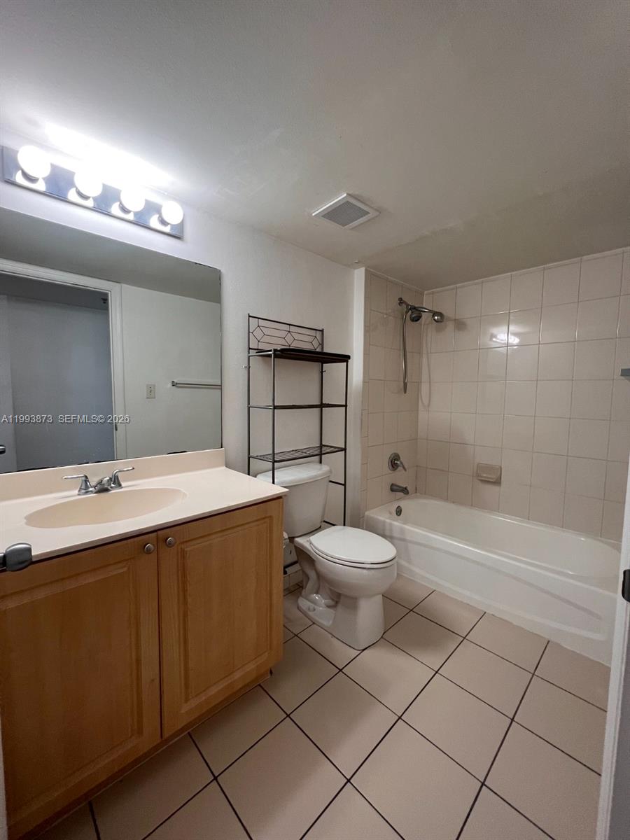 102 Southwest 6th Avenue, Unit 508 Miami, FL 33130 - Photo 27 of 27 a bathroom with a sink a toilet and shower