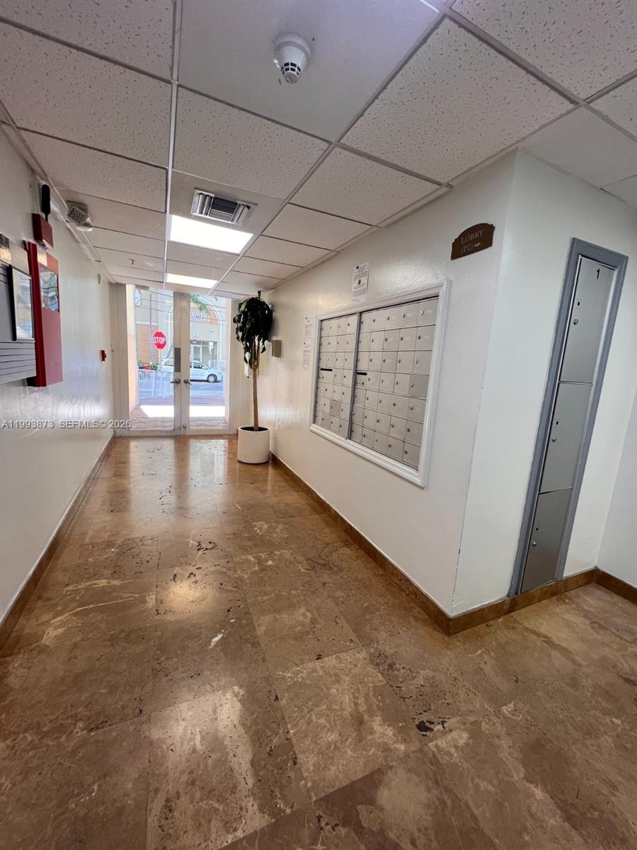102 Southwest 6th Avenue, Unit 508 Miami, FL 33130 - Photo 5 of 27 a view of a livingroom with an empty space and a garage