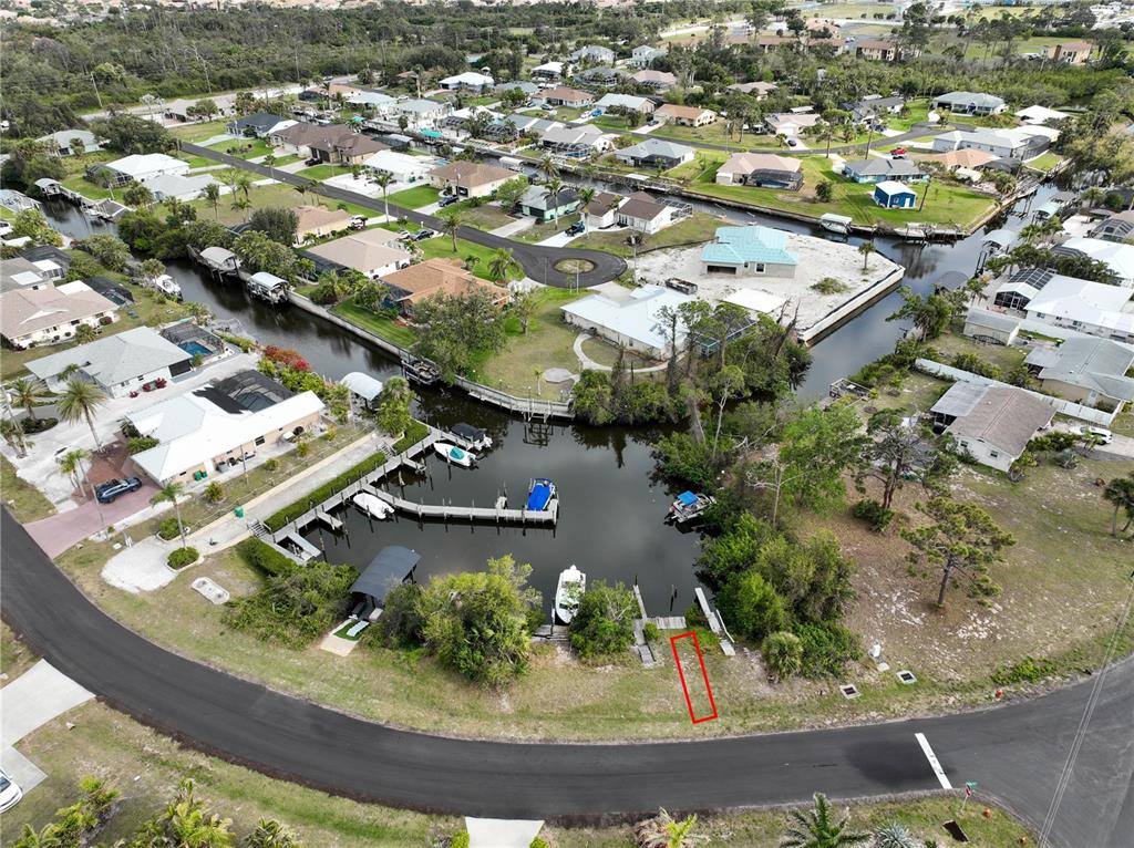 2613 Lear Road, Unit B LOT 14 Englewood, FL 34224 - Photo 2 of 5 an aerial view of a residential houses with outdoor space