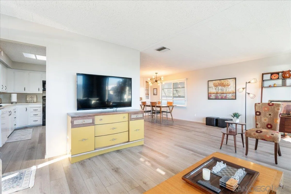 90 Blue Sky Lane Oceanside, CA 92056 - Photo 12 of 31 a living room with furniture and a flat screen tv