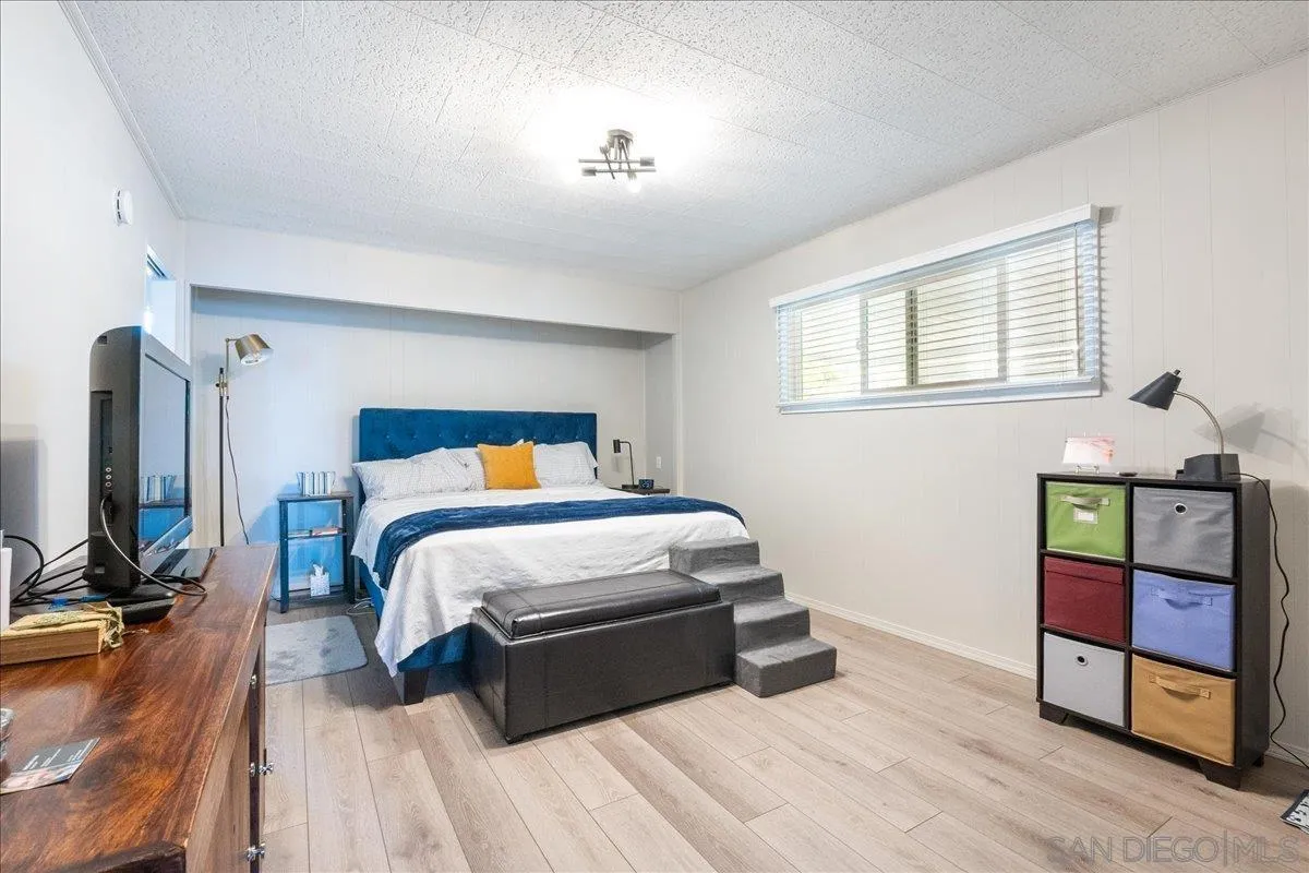 90 Blue Sky Lane Oceanside, CA 92056 - Photo 15 of 31 a bedroom with a bed and a mirror