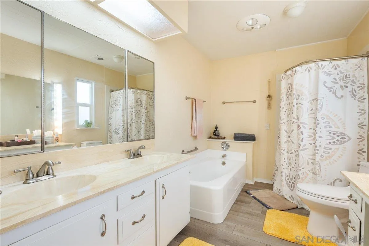 90 Blue Sky Lane Oceanside, CA 92056 - Photo 18 of 31 a spacious bathroom with a double vanity sink mirror and bathtub