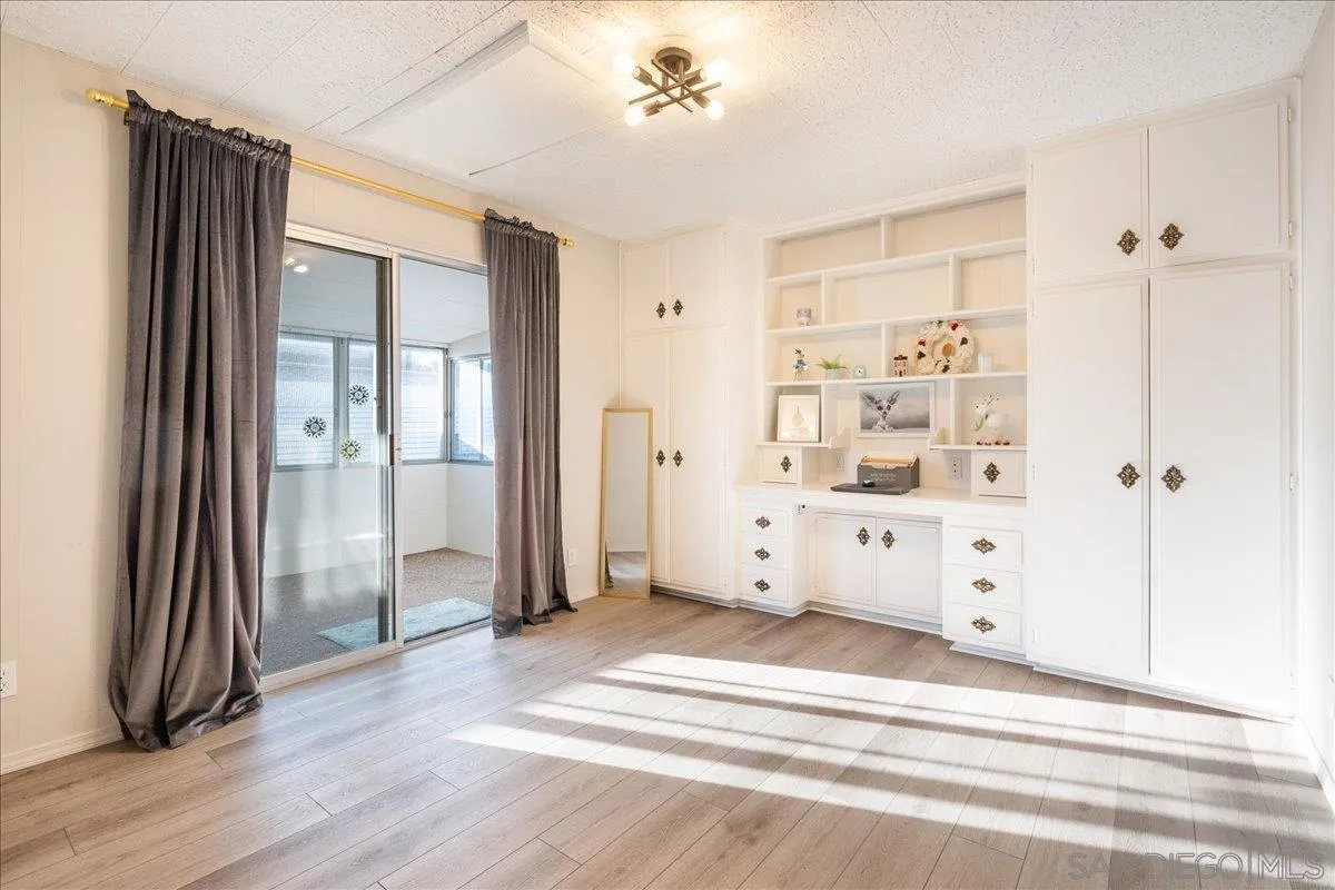 90 Blue Sky Lane Oceanside, CA 92056 - Photo 20 of 31 a view of a hallway with wooden floor and closet area