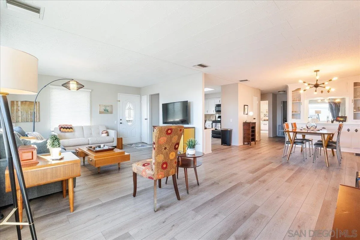 90 Blue Sky Lane Oceanside, CA 92056 - Photo 3 of 31 a living room with furniture and a wooden floor