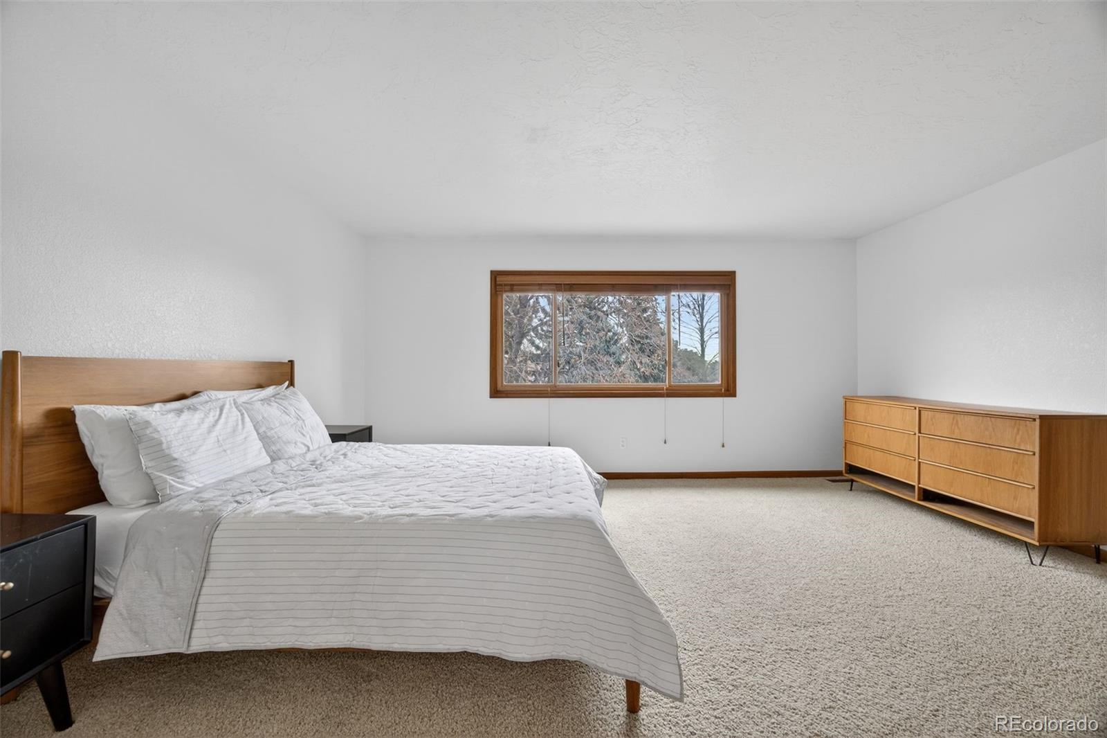 3200 Zephyr Court Wheat Ridge, CO 80033 - Photo 16 of 45 a bedroom with a bed and a couch