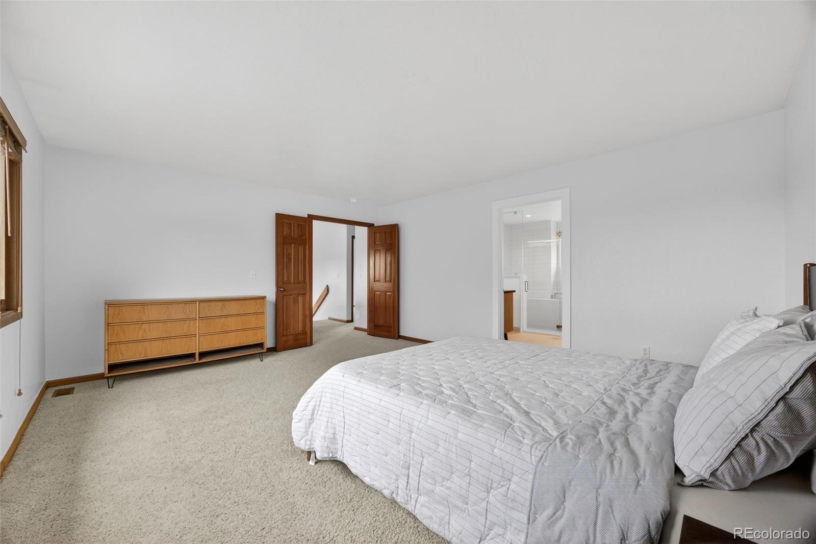 3200 Zephyr Court Wheat Ridge, CO 80033 - Photo 17 of 45 a bed room with a bed and a window