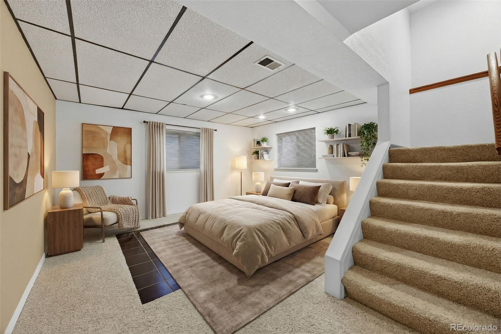 3200 Zephyr Court Wheat Ridge, CO 80033 - Photo 27 of 45 a spacious bedroom with a bed a couch and dresser