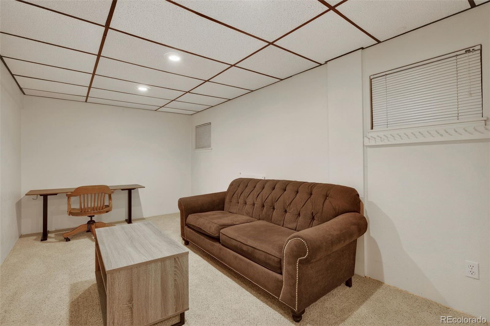3200 Zephyr Court Wheat Ridge, CO 80033 - Photo 31 of 45 a living room with furniture and a couch