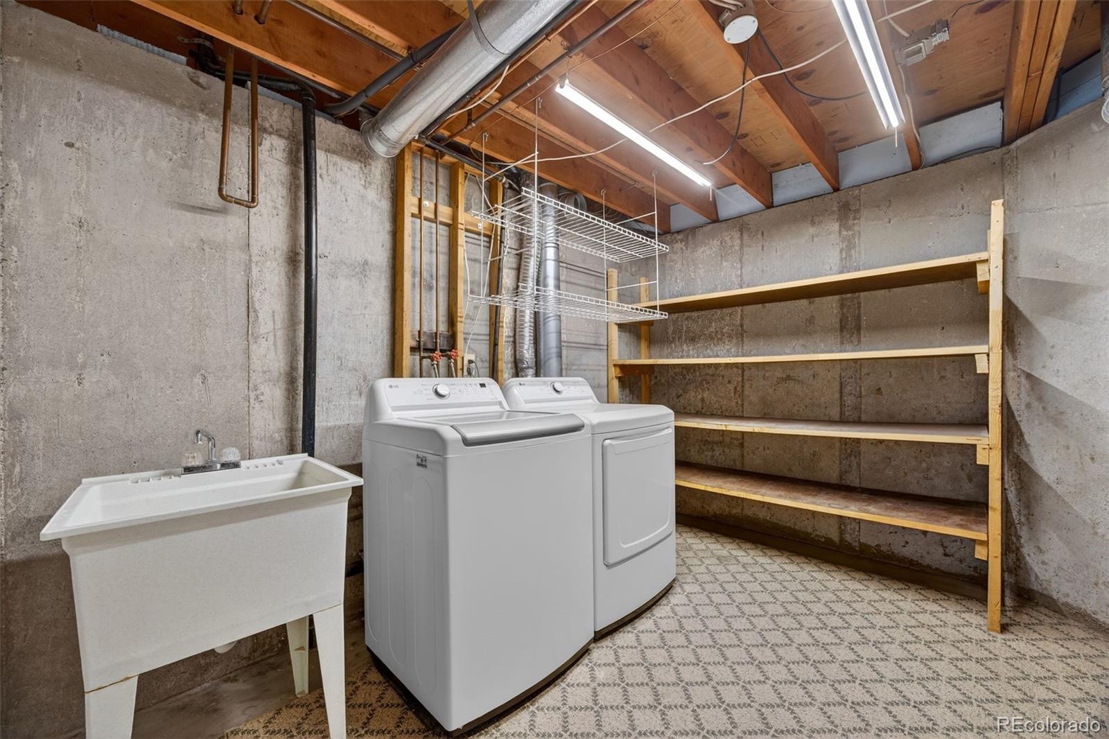 3200 Zephyr Court Wheat Ridge, CO 80033 - Photo 36 of 45 a utility room with dryer and washer