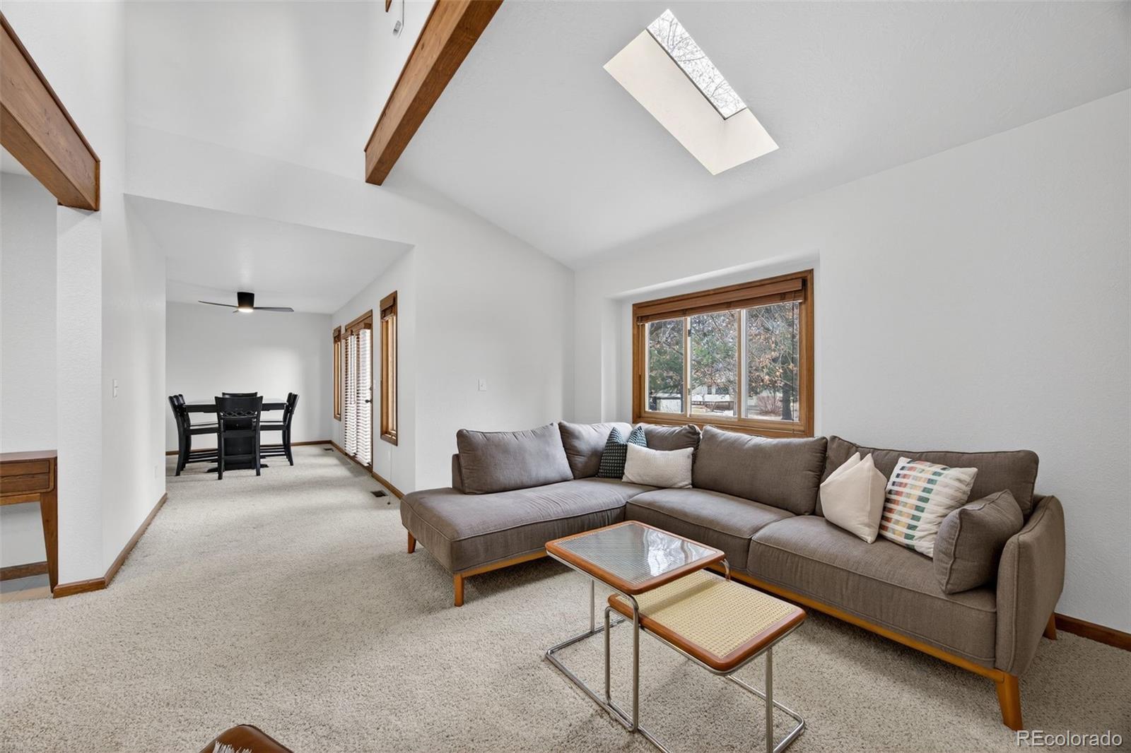 3200 Zephyr Court Wheat Ridge, CO 80033 - Photo 6 of 45 a living room with furniture and a large window