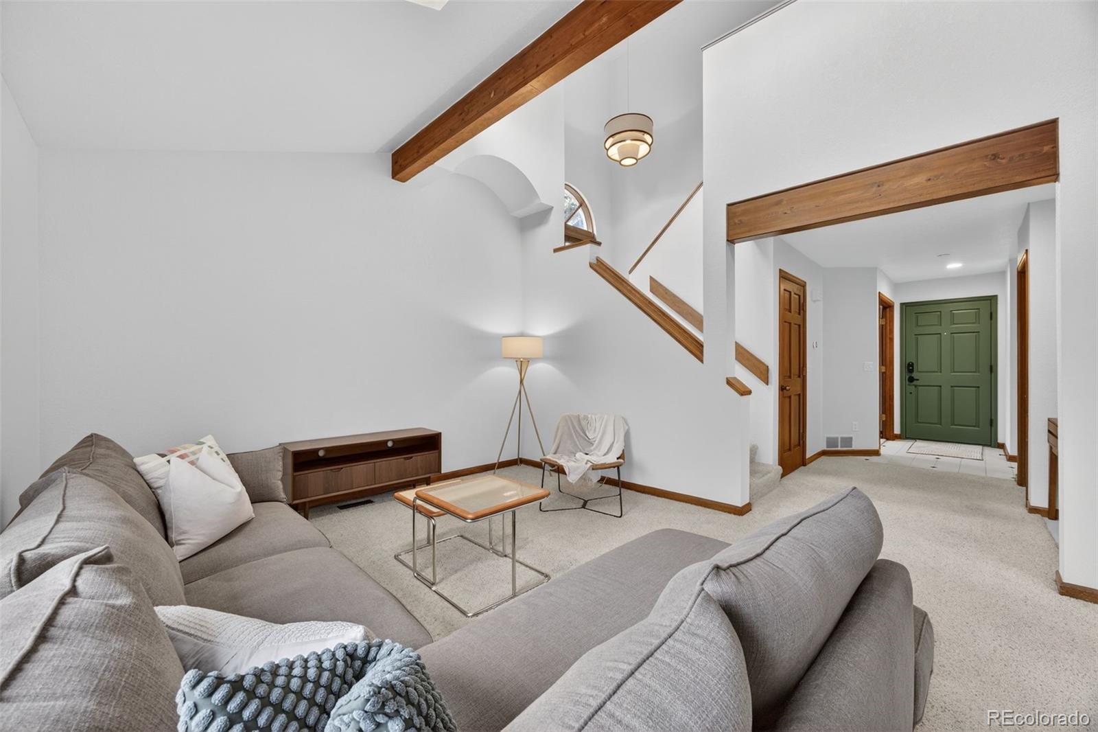 3200 Zephyr Court Wheat Ridge, CO 80033 - Photo 8 of 45 a living room with furniture and stairs