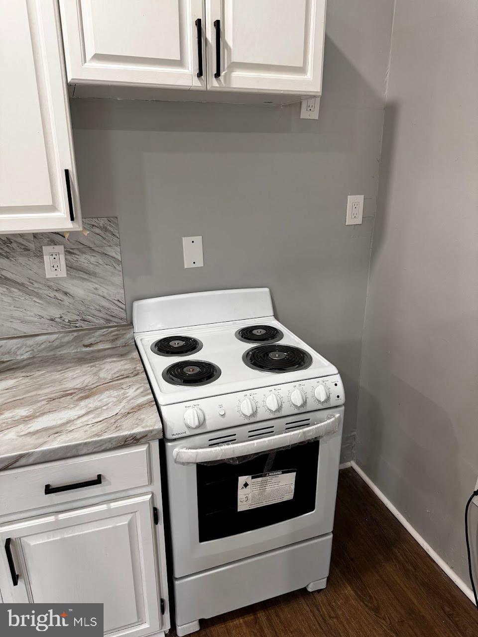 5003 Penn Street, Unit 1F Philadelphia, PA 19124 - Photo 5 of 11 a stove top oven sitting inside of a kitchen