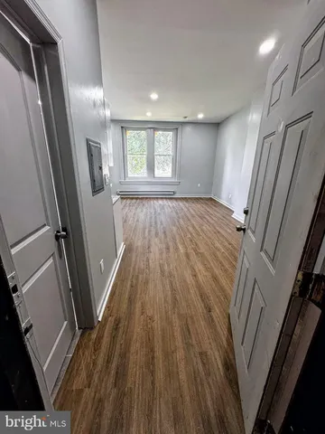 a view of a room that has a window in it