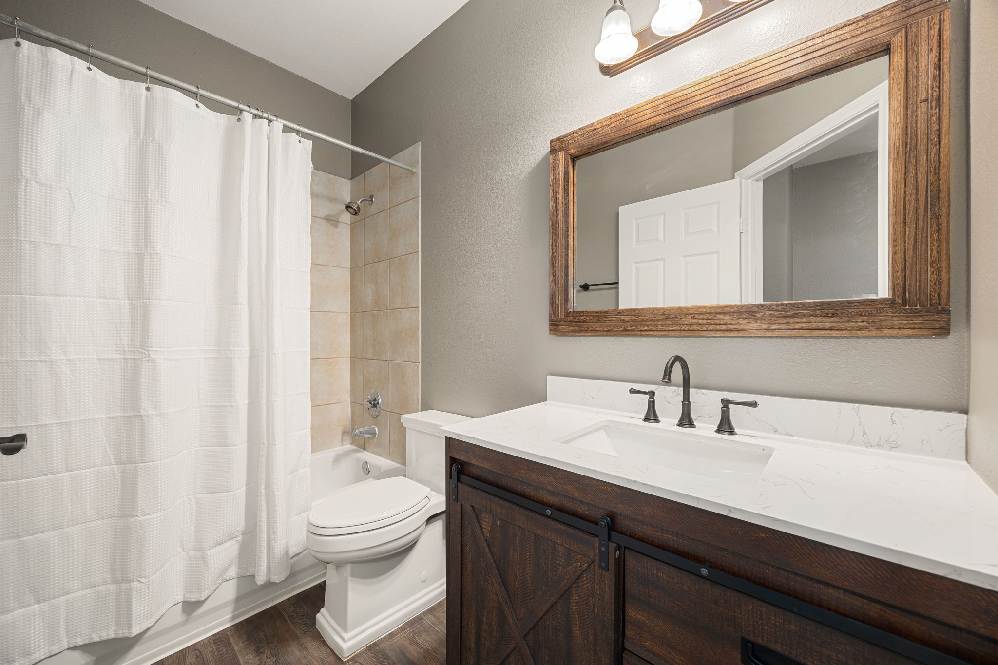 4805 Louis Avenue Austin, TX 78721 - Photo 14 of 23 a bathroom with a sink a toilet and a mirror