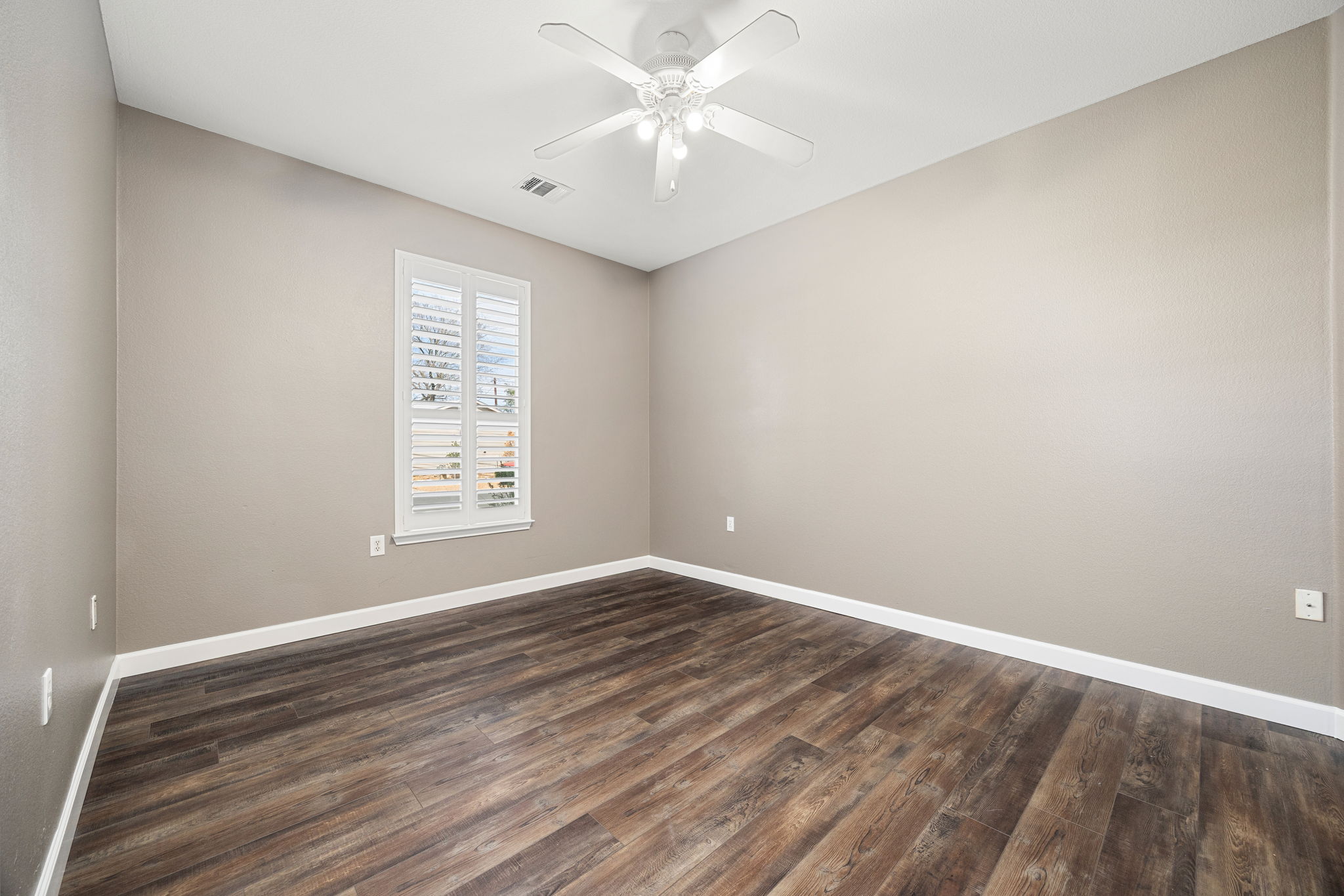 4805 Louis Avenue Austin, TX 78721 - Photo 15 of 23 wooden floor in an empty room with a window